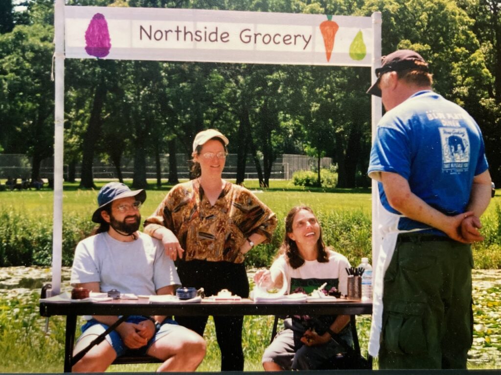 Chris Moore, Lisa Wiese, and Claudia Rosembaum advertising for members for the Northside Community Coop Summer 2004